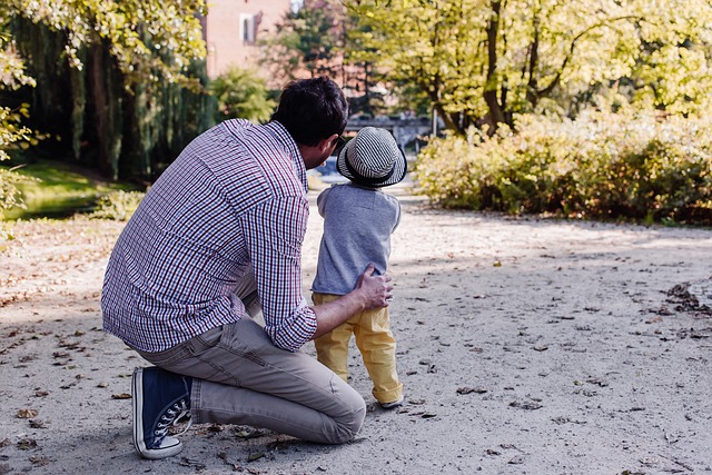 father showing kid something