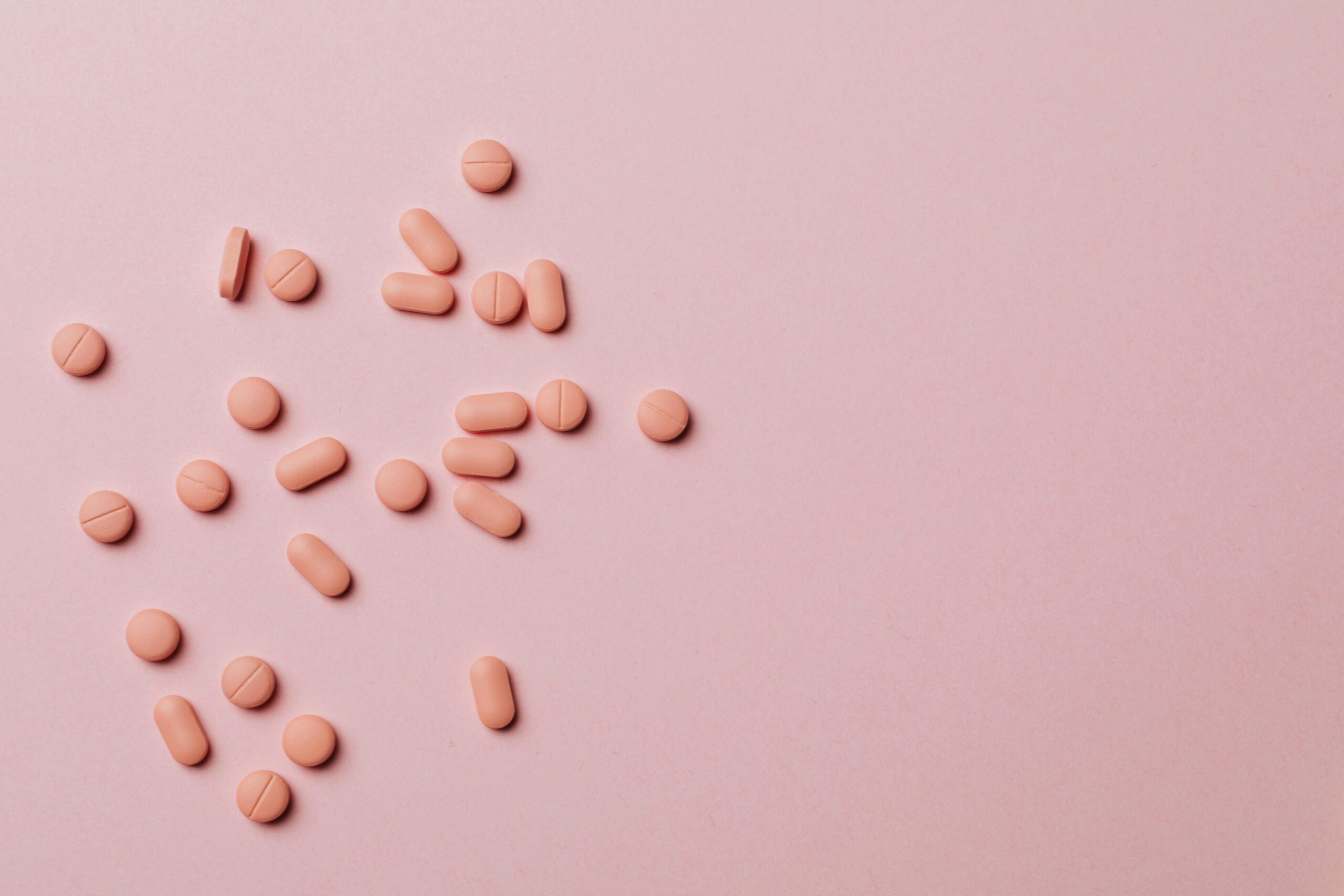 pink pills on pink background