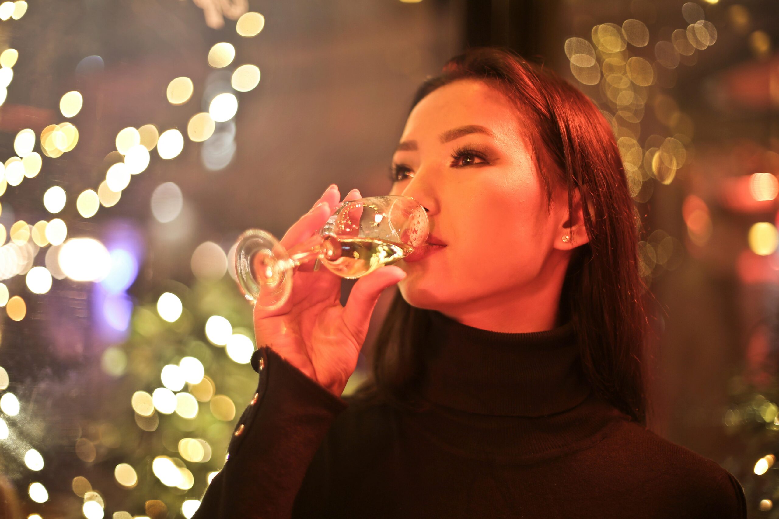 woman having a sip of wine