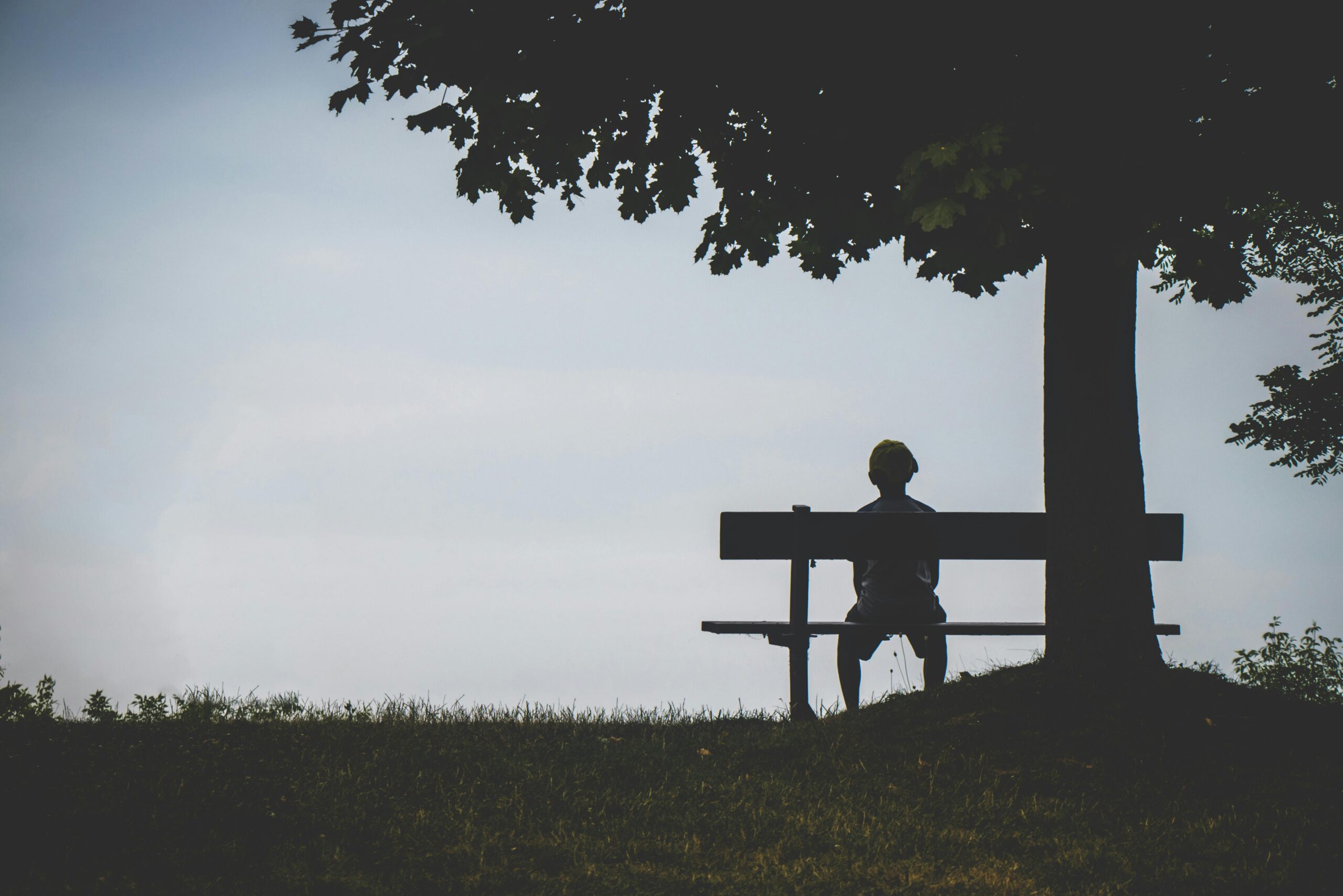 person very lonely on a bench outside