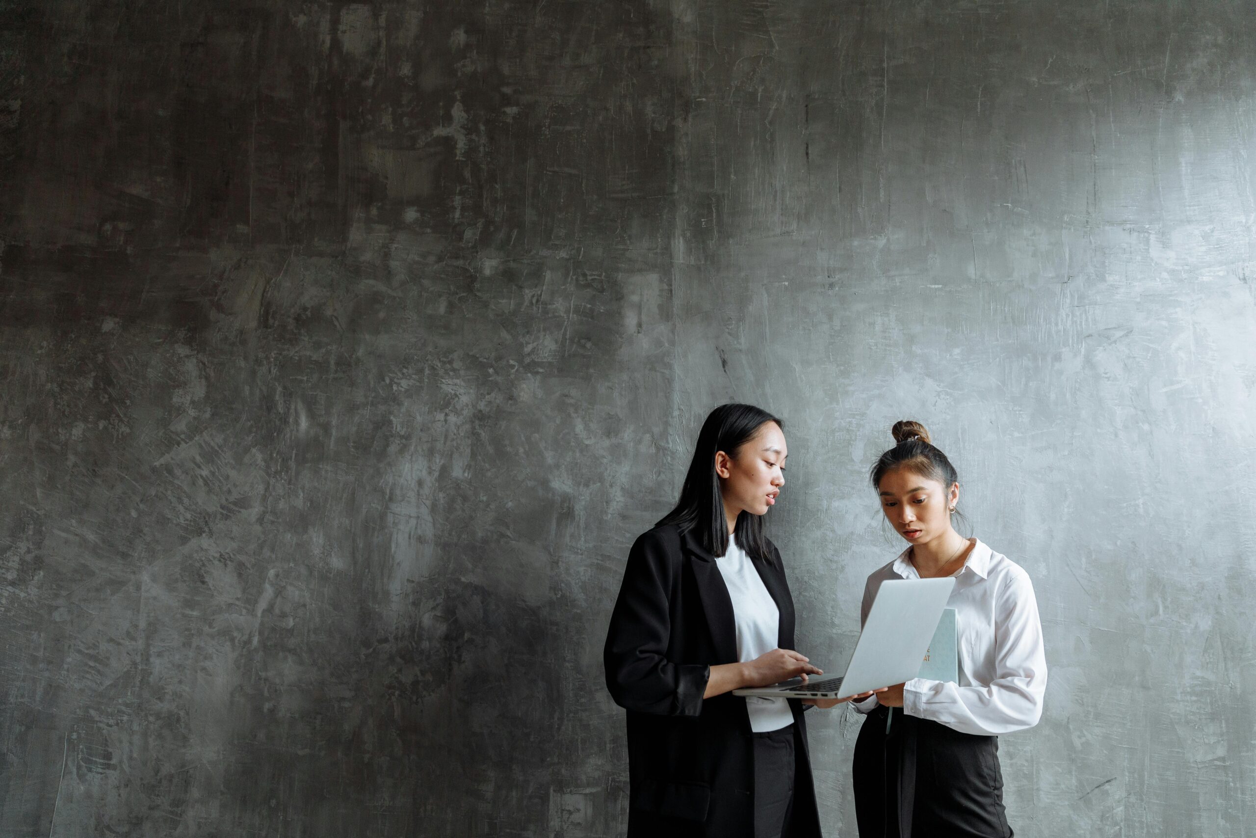 two women on a laptop together