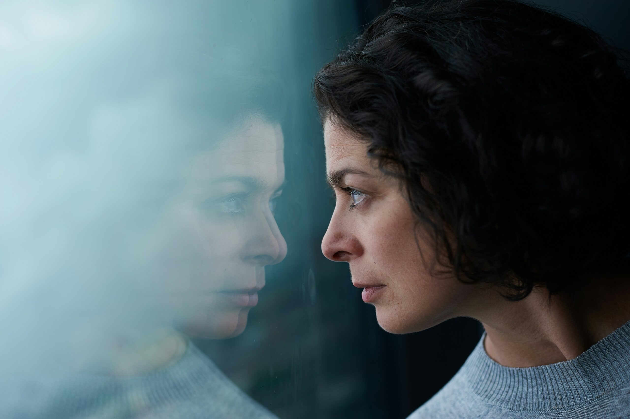 woman looking out through the window