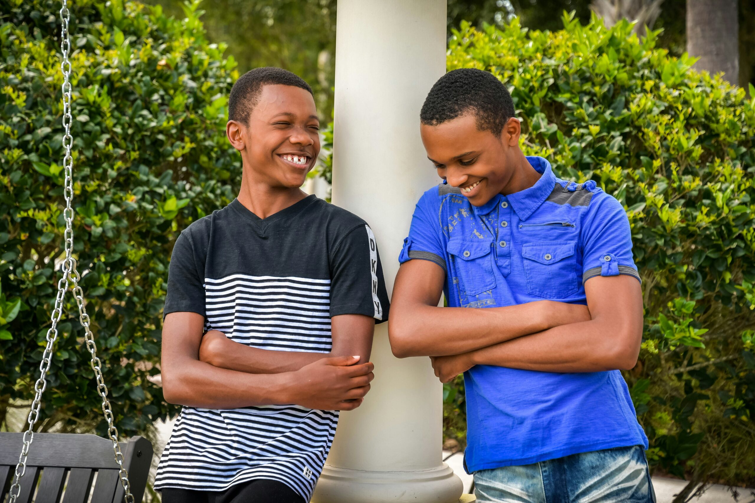 two young teenage boys laughing