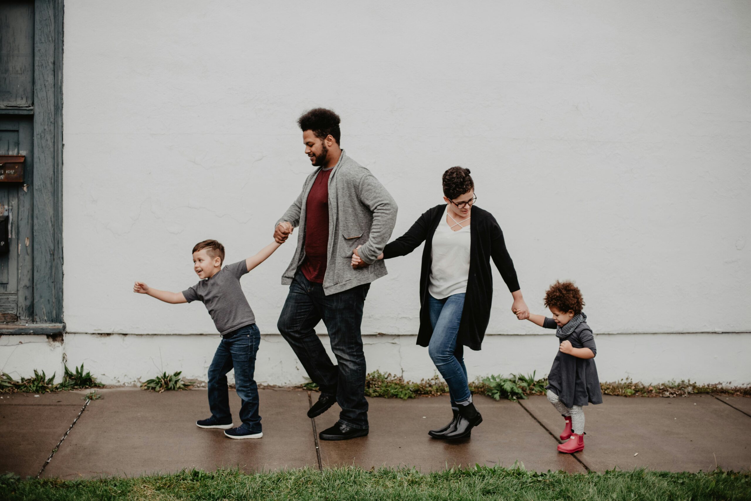 parents walking with their kids on the sidewalks