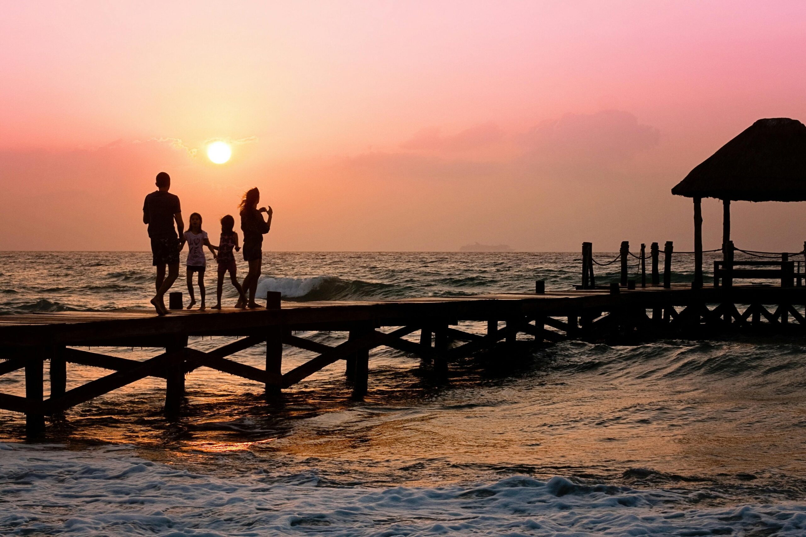 family walking on a bridge