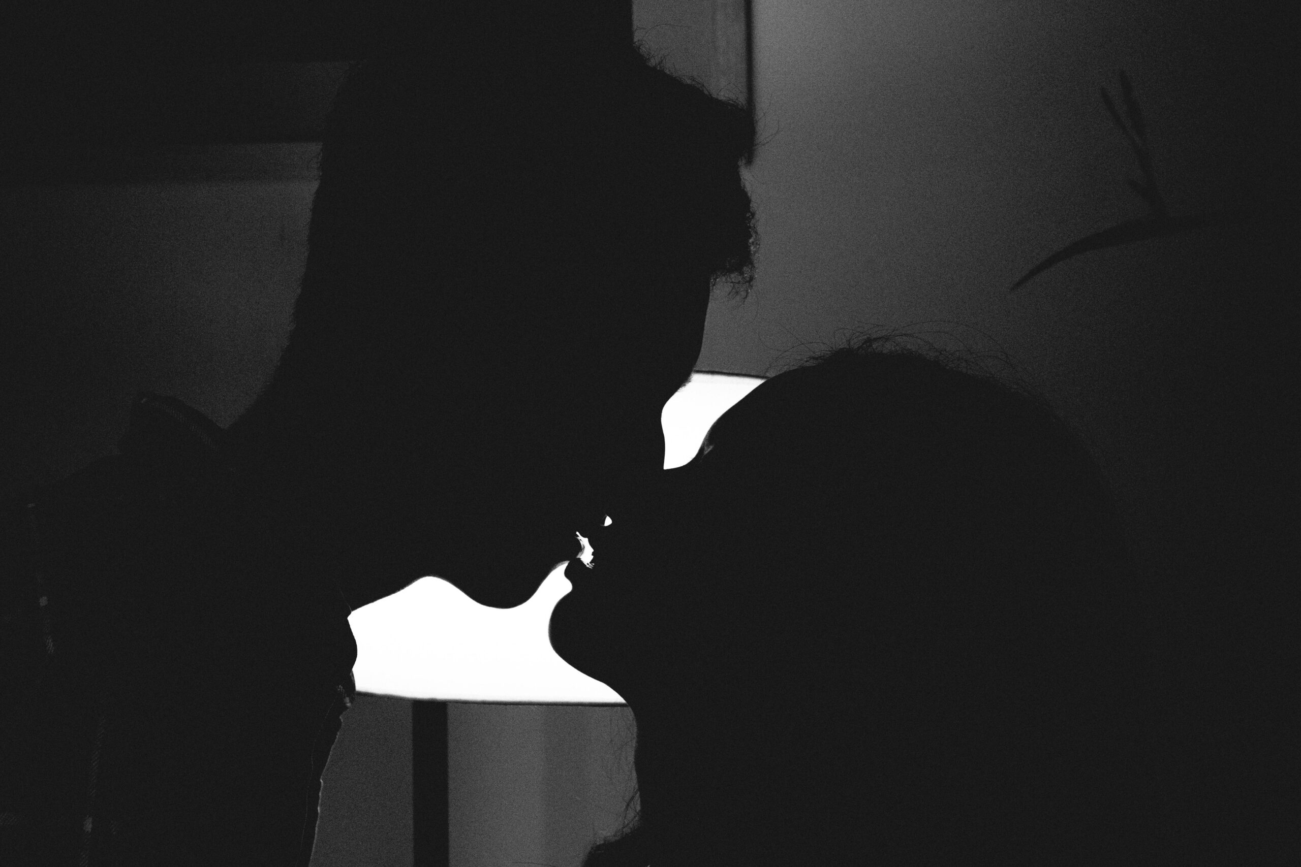 two people kissing one another