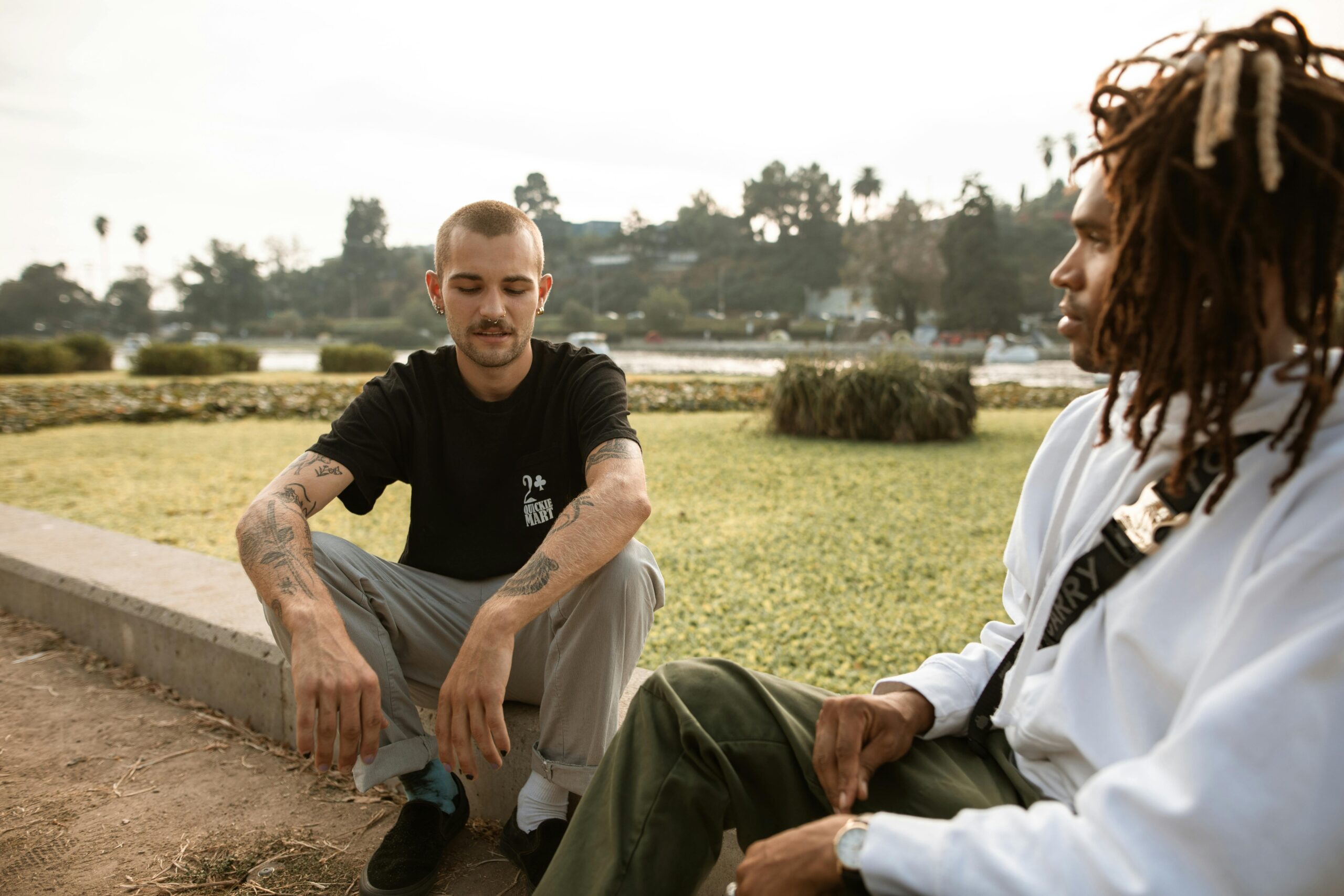 two men talking to each others outside