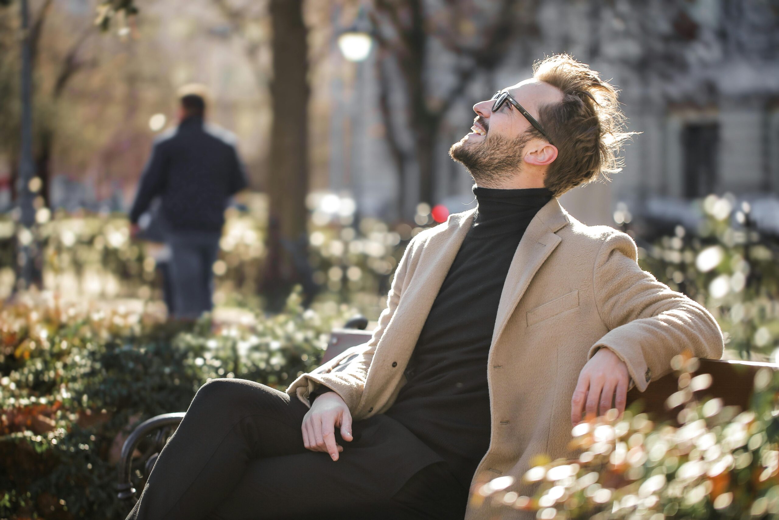man sitting on a bench at the park