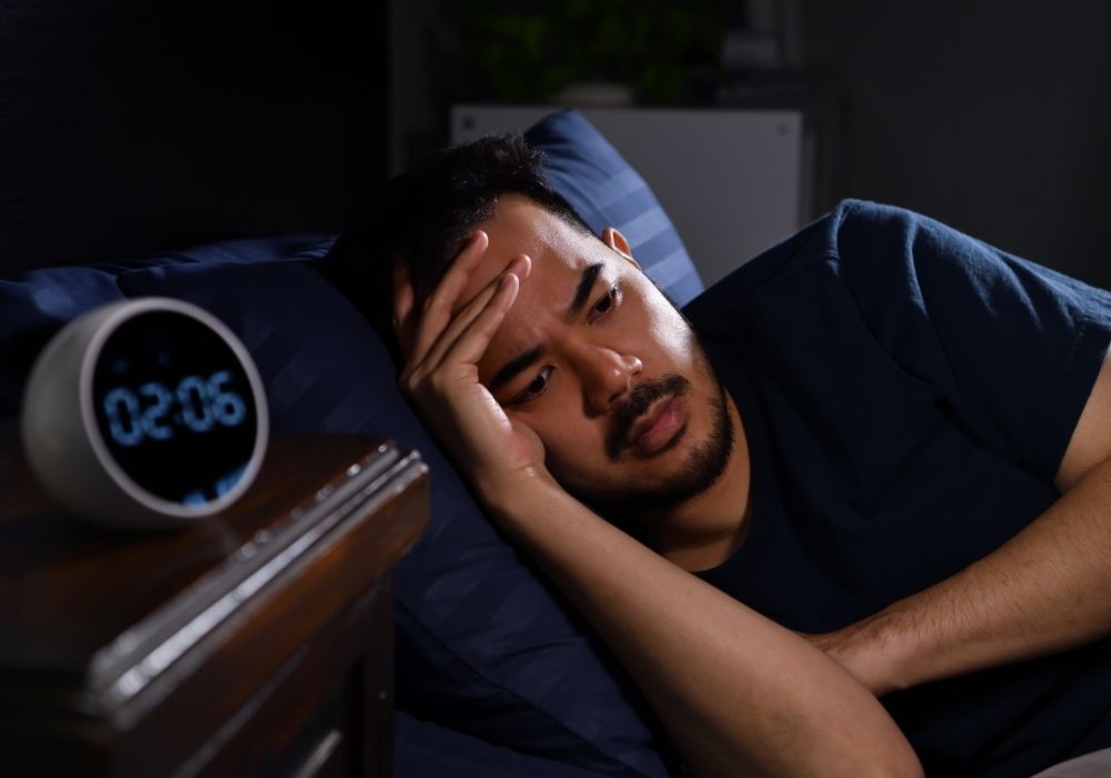man suffering from insomnia